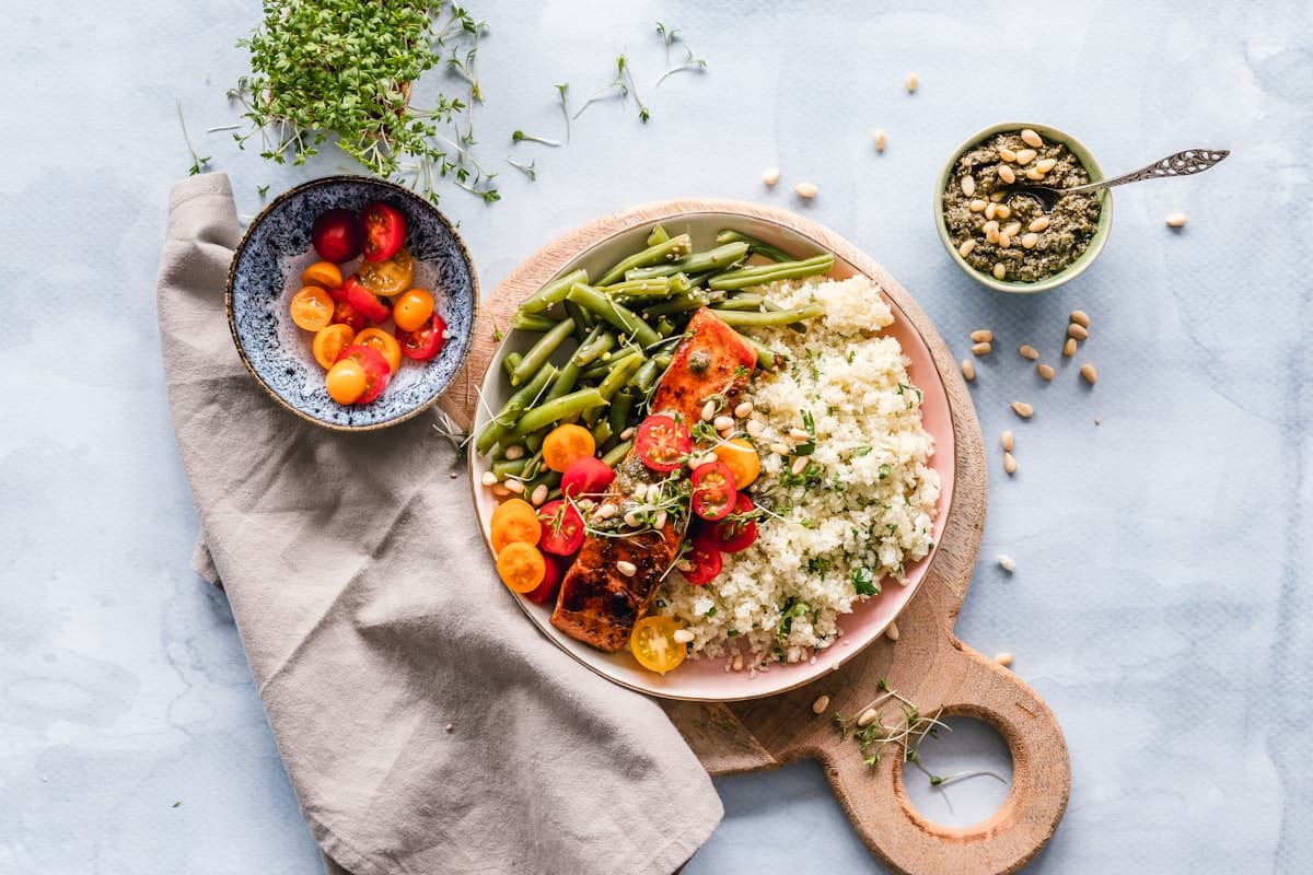 Meal prep containers with balanced portions of protein, carbs, and vegetables